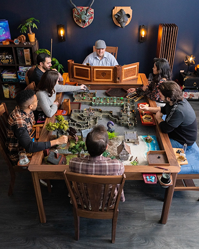 An image of a group of people playing dungeons and dragons at a table